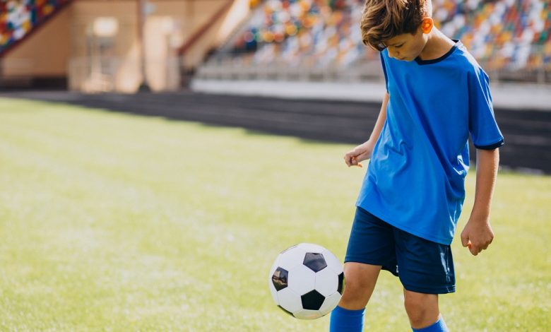 kid play soccer